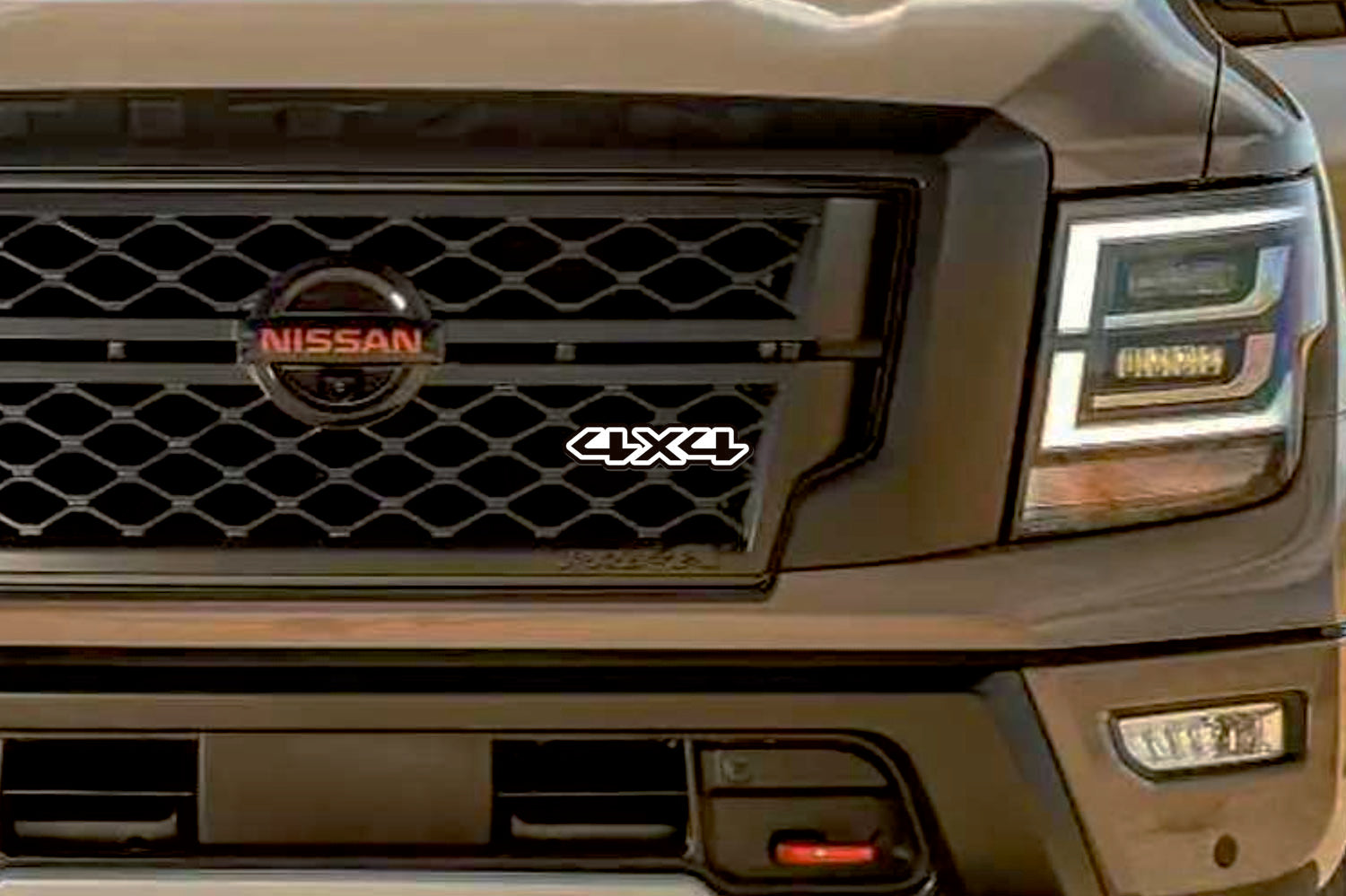 Nissan Radiator grille emblem with 4x4 logo