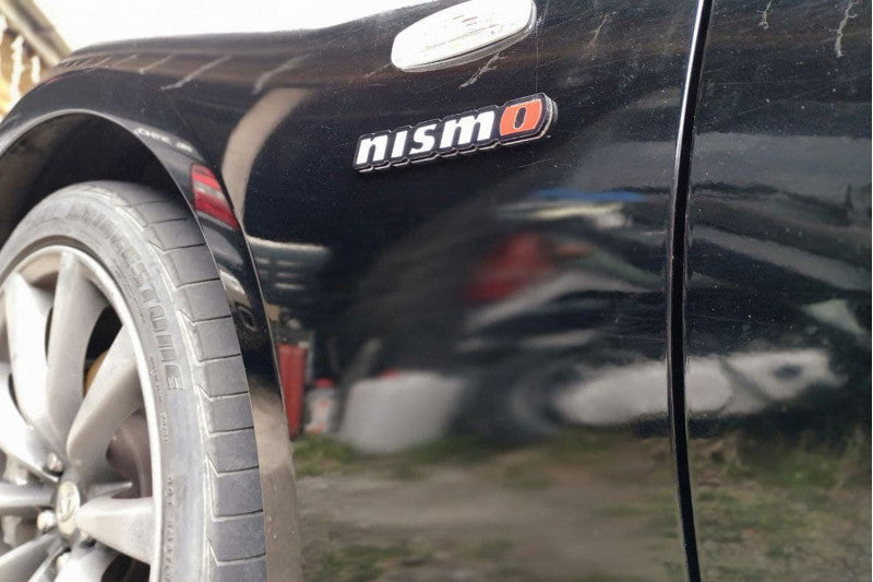 Infiniti emblem for fenders with Nismo logo