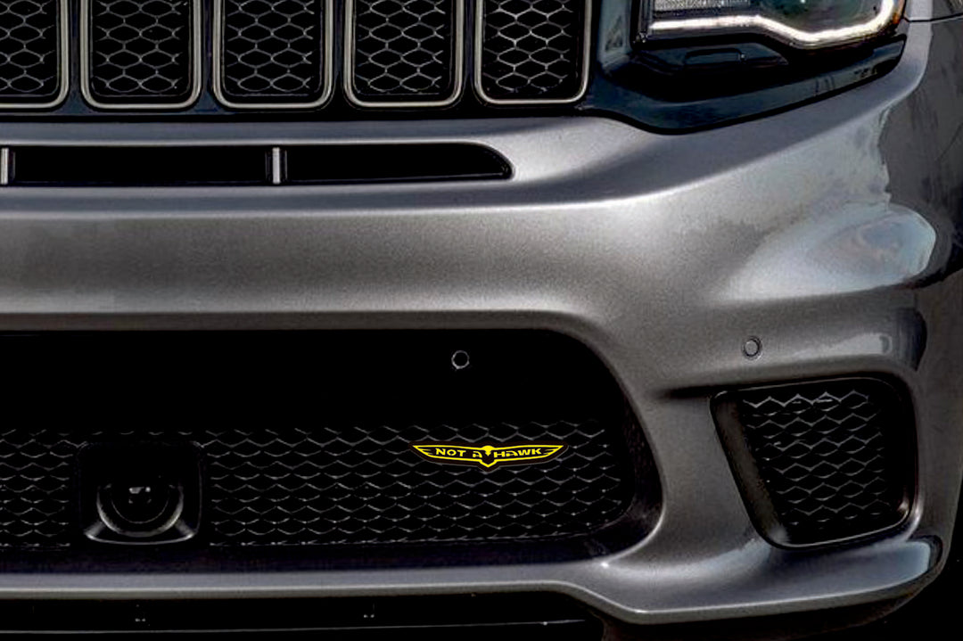 Radiator grille emblem with Not a Hawk logo